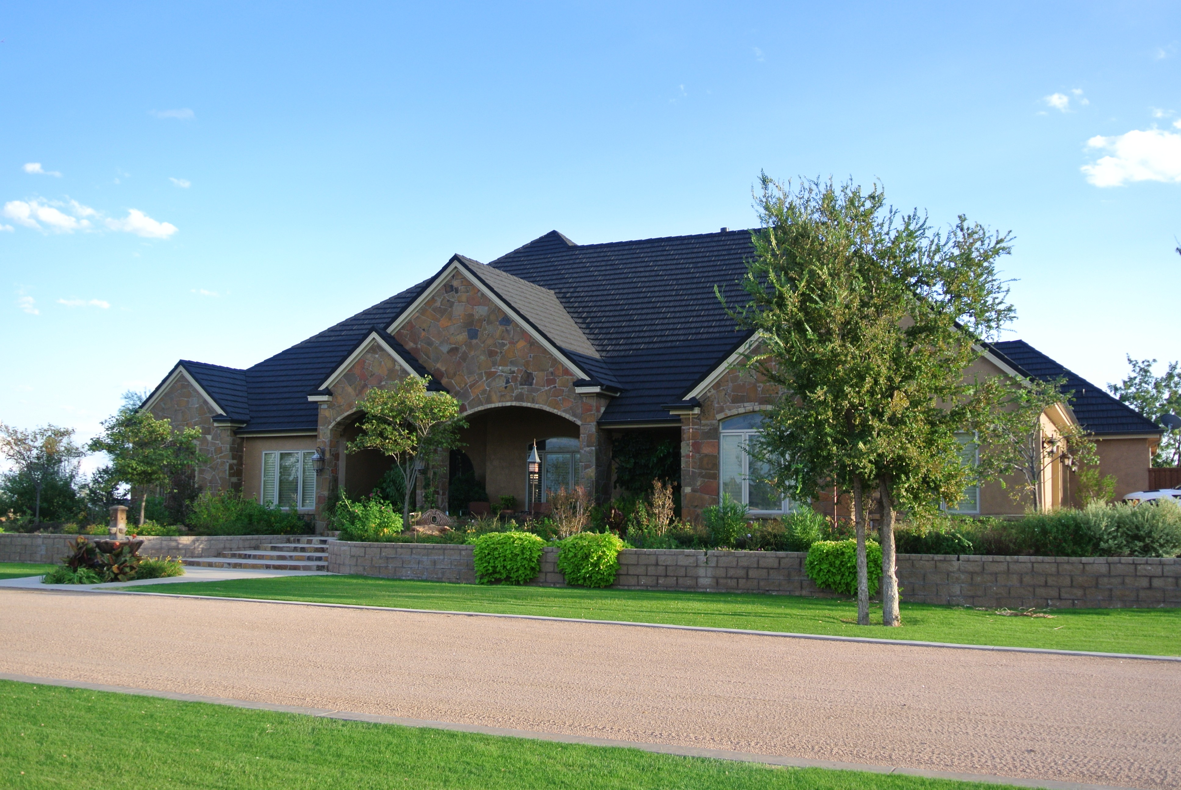 Gerard Canyon Shake Charcoal stone-coated steel on stone estate, Central Texas