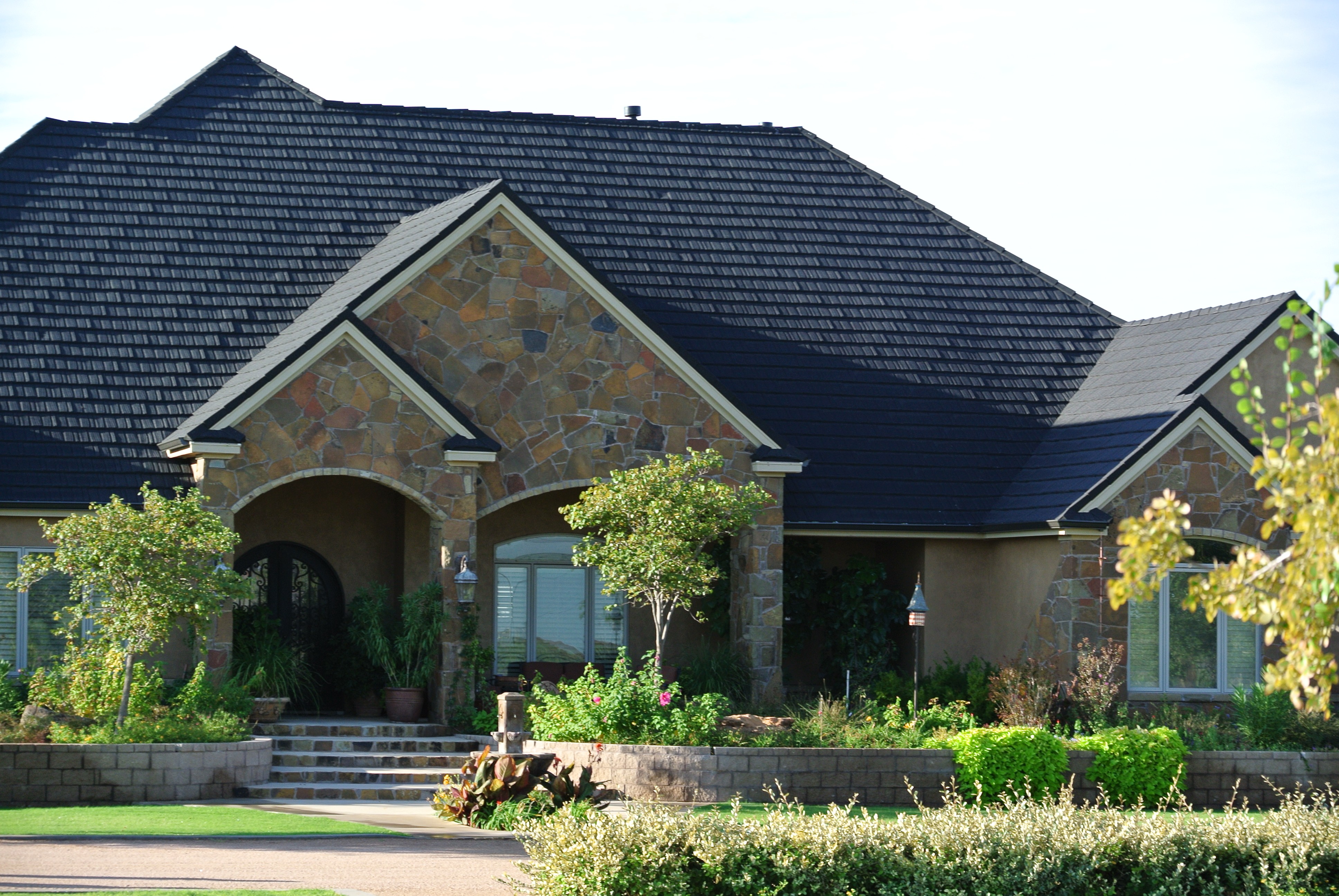 Gerard Canyon Shake charcoal stone-coated metal roof installed by Watson Roofing on a Central Texas home