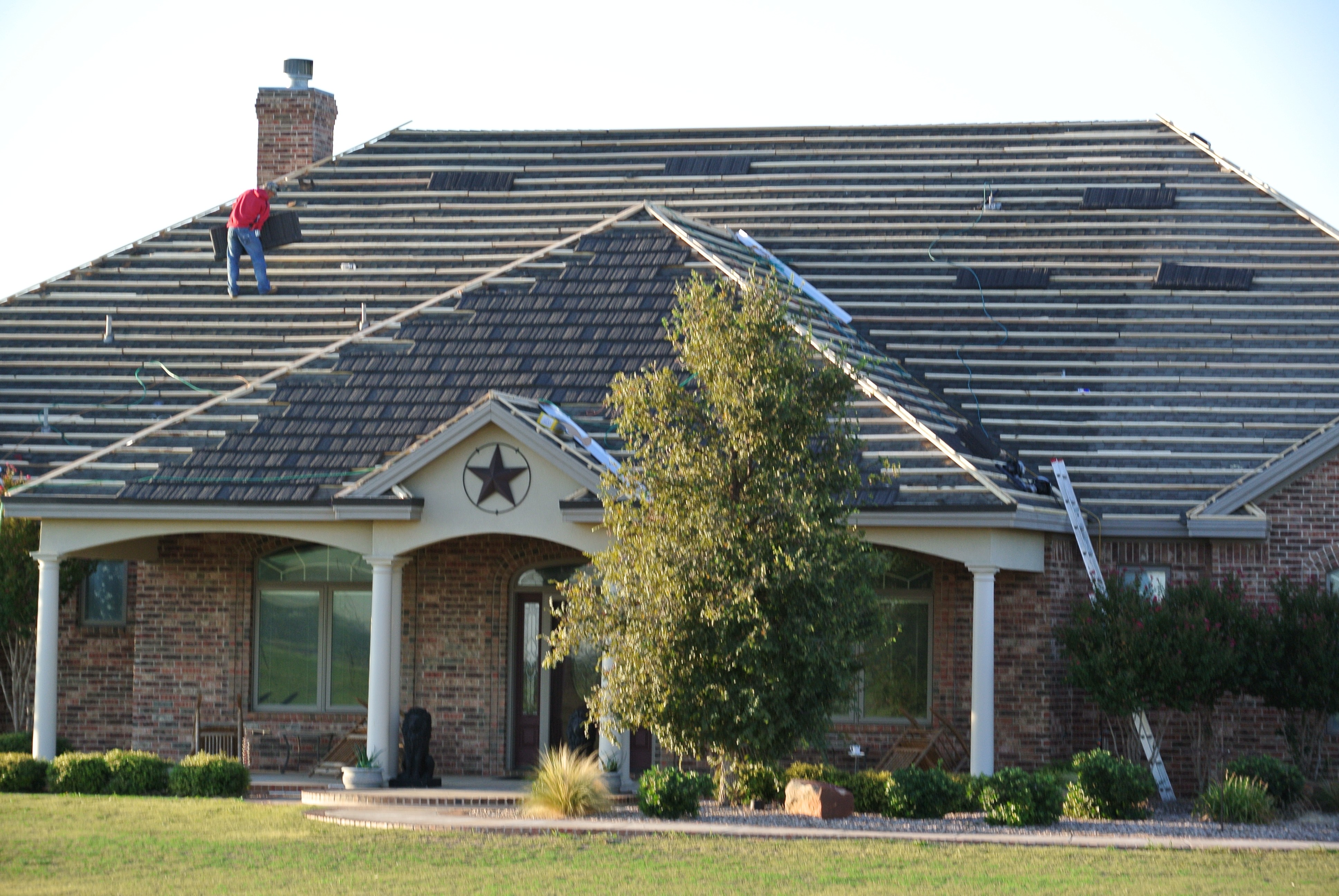 Watson Roofing crew installing new roof, Brownwood TX
