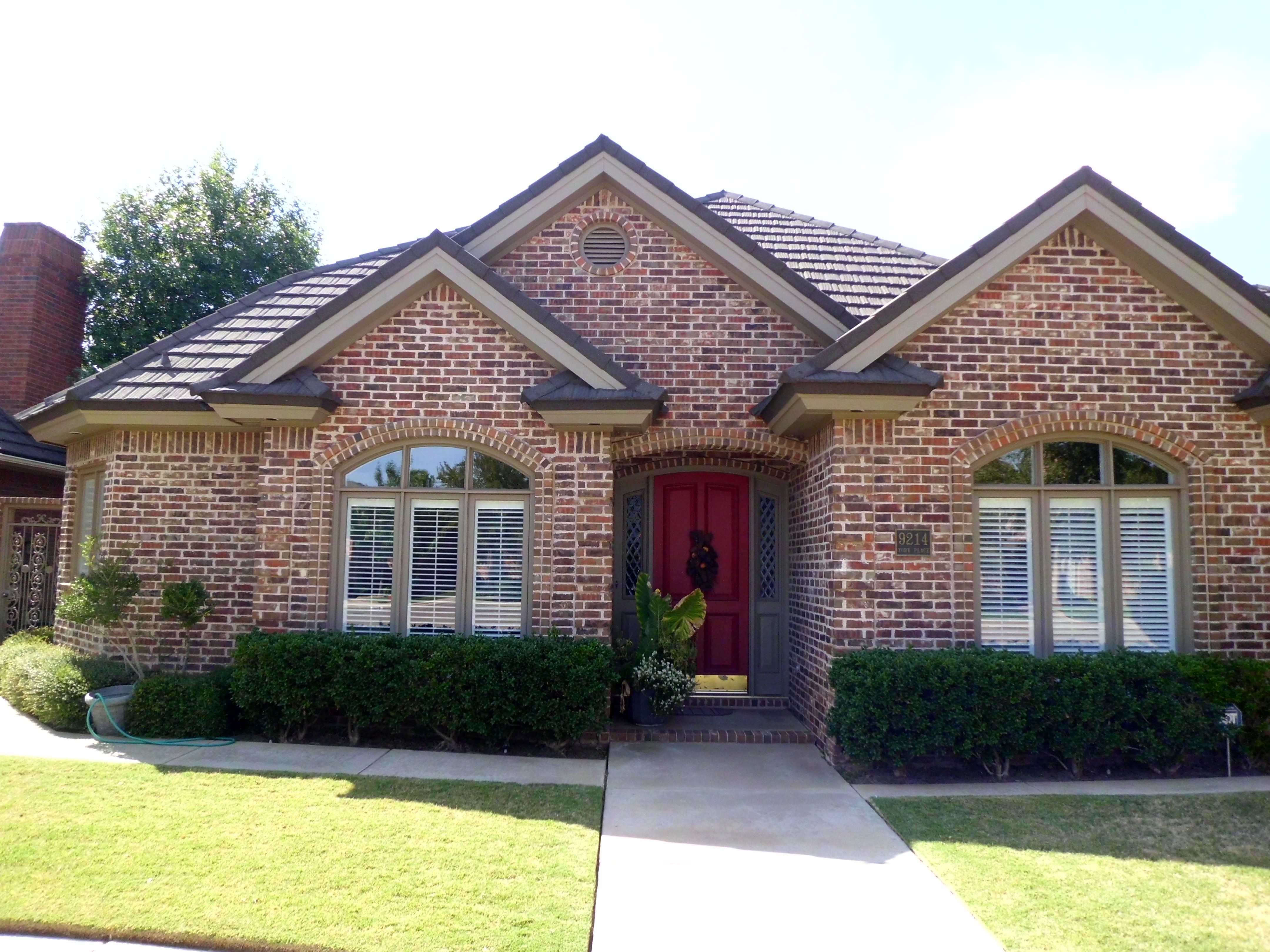Completed roof replacement on brick home, Central Texas